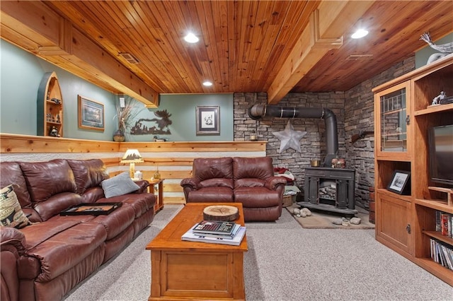 1684 Quarry Rd, Bates City, MO 64011 - living room featuring a wood stove, carpet floors, wood ceiling, and recessed lighting