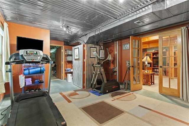 1684 Quarry Rd, Bates City, MO 64011 - exercise room with french doors and track lighting