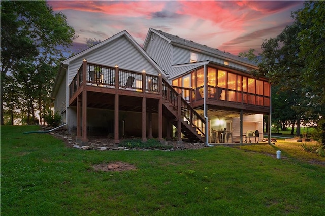 1684 Quarry Rd, Bates City, MO 64011 - back of property featuring a sunroom, a deck, a lawn, and stairs
