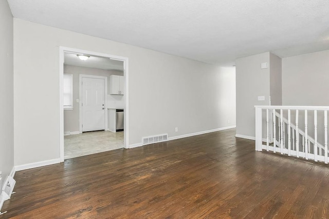 13309 Winchester Ave, Grandview, MO 64030 - unfurnished room with wood finished floors and baseboards