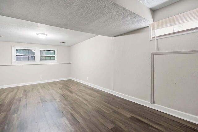 13309 Winchester Ave, Grandview, MO 64030 - spare room featuring a textured ceiling and wood finished floors