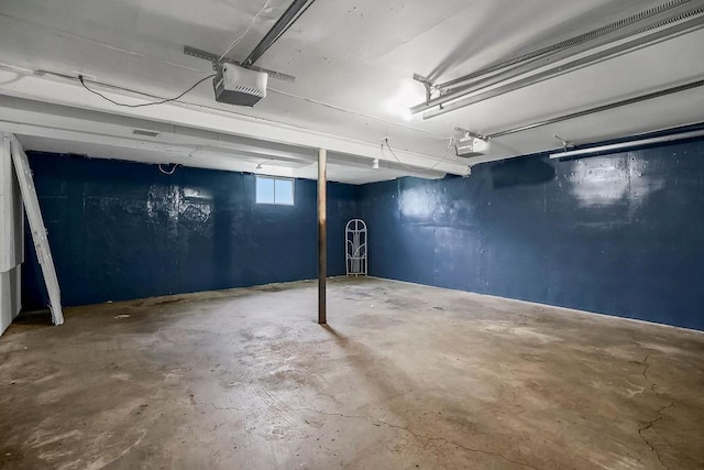 13309 Winchester Ave, Grandview, MO 64030 - garage featuring a garage door opener