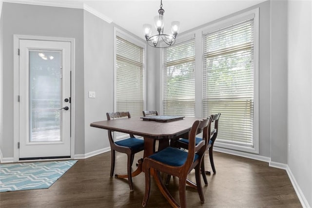 5329 Park St, Shawnee, KS 66216 - dining space featuring a chandelier, dark wood-style flooring, and crown molding