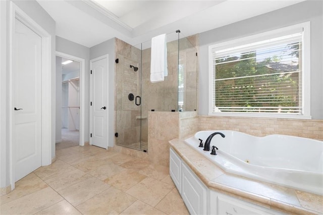 5329 Park St, Shawnee, KS 66216 - bathroom with a whirlpool tub, a shower stall, healthy amount of natural light, and a spacious closet