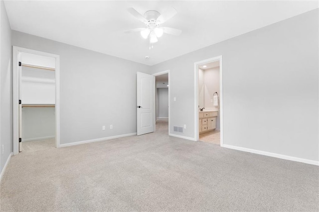 5329 Park St, Shawnee, KS 66216 - unfurnished bedroom with a spacious closet, a closet, and light carpet