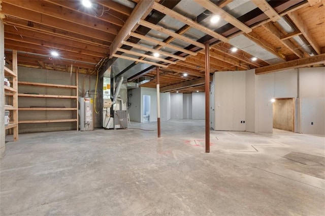 5329 Park St, Shawnee, KS 66216 - unfinished basement featuring water heater and heating unit