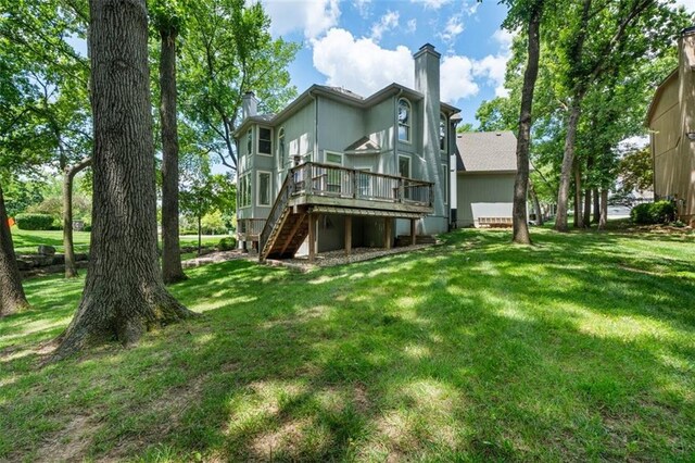 5329 Park St, Shawnee, KS 66216 - back of house featuring a chimney, stairway, a wooden deck, and a lawn