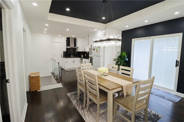 2725 N 20th St, Kansas City, KS 66104 - dining room with dark wood-style flooring, recessed lighting, a raised ceiling, and a chandelier
