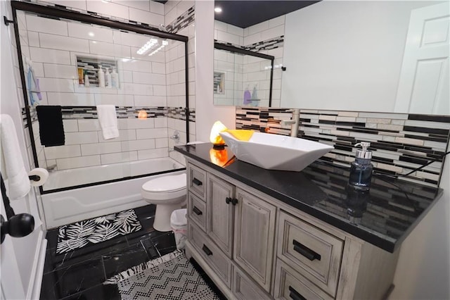2725 N 20th St, Kansas City, KS 66104 - bathroom featuring vanity, bath / shower combo with glass door, and tasteful backsplash
