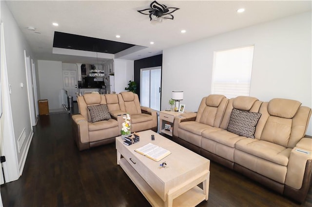 2725 N 20th St, Kansas City, KS 66104 - living area with wood finished floors, recessed lighting, and a raised ceiling