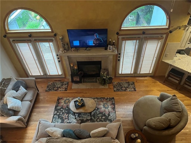 15733 Pine Cir, Basehor, KS 66007 - living area with a tile fireplace and wood finished floors