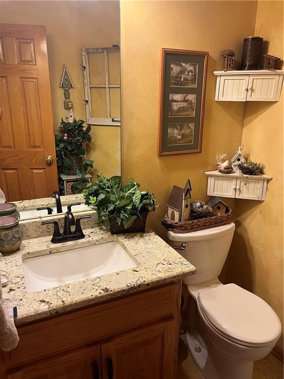 15733 Pine Cir, Basehor, KS 66007 - bathroom featuring vanity and toilet