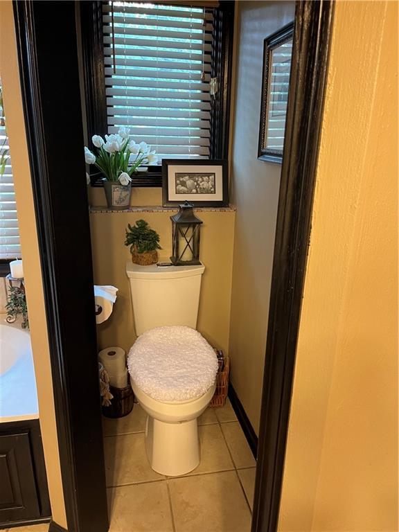 15733 Pine Cir, Basehor, KS 66007 - bathroom with tile patterned flooring and vanity