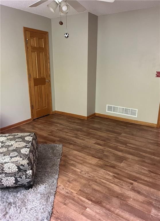 15733 Pine Cir, Basehor, KS 66007 - unfurnished living room featuring wood finished floors and ceiling fan