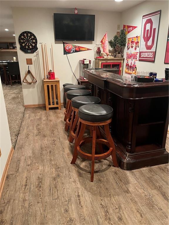 15733 Pine Cir, Basehor, KS 66007 - indoor dry bar featuring recessed lighting and wood finished floors