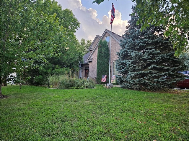 15733 Pine Cir, Basehor, KS 66007 - view of side of property featuring a lawn