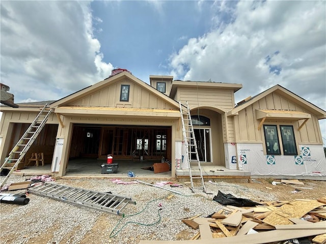 8337 NE 76th Ter, Kansas City, MO 64158 - property under construction with board and batten siding and an attached garage