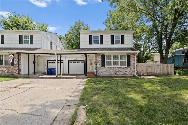 9410 Taylor Dr, Overland Park, KS 66212 - traditional home with an attached garage, brick siding, and driveway
