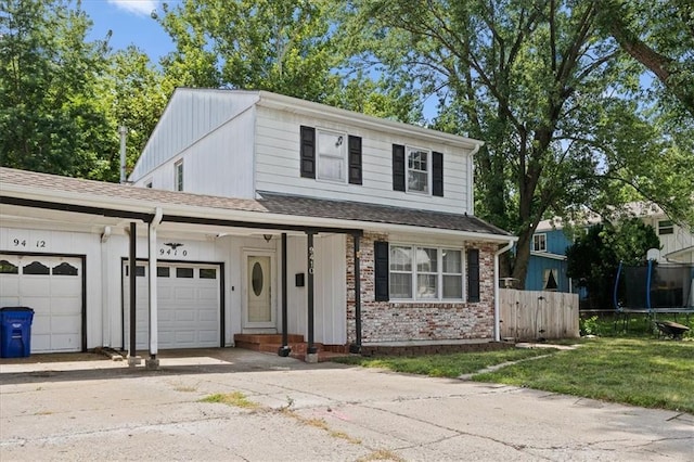 9410 Taylor Dr, Overland Park, KS 66212 - view of front of house featuring a garage, concrete driveway, and brick siding