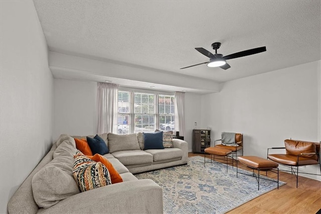 9410 Taylor Dr, Overland Park, KS 66212 - living room featuring a textured ceiling, wood finished floors, and a ceiling fan