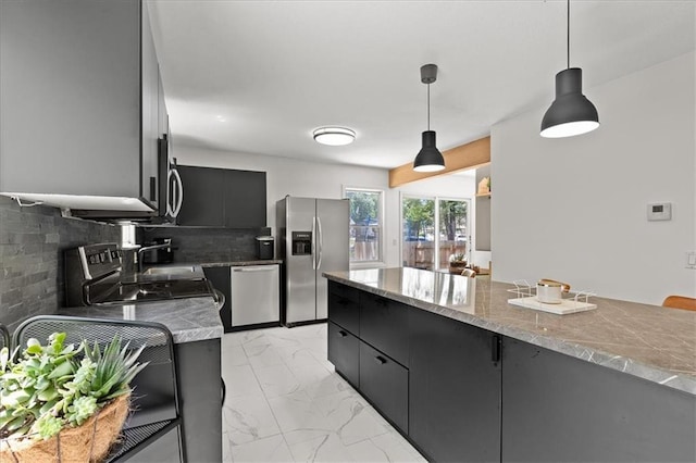9410 Taylor Dr, Overland Park, KS 66212 - kitchen featuring appliances with stainless steel finishes, pendant lighting, light marble finish floors, dark cabinets, and tasteful backsplash