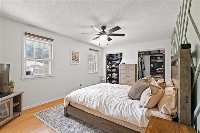 9410 Taylor Dr, Overland Park, KS 66212 - bedroom with light wood-style flooring, a textured ceiling, and a ceiling fan