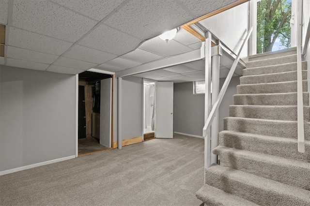 9410 Taylor Dr, Overland Park, KS 66212 - basement with stairs, carpet, and healthy amount of natural light