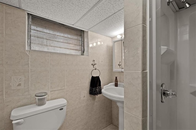 9410 Taylor Dr, Overland Park, KS 66212 - full bathroom featuring a stall shower and tile walls
