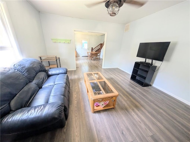712 N Jefferson Ave, Iola, KS 66749 - living area with ceiling fan and wood finished floors