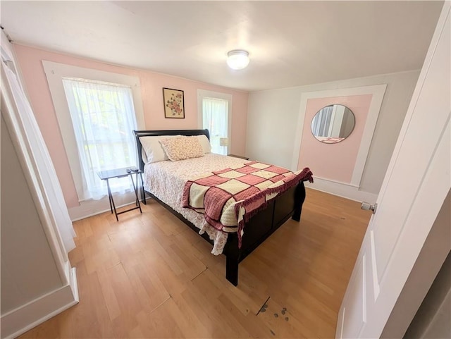 712 N Jefferson Ave, Iola, KS 66749 - bedroom with light wood-style floors