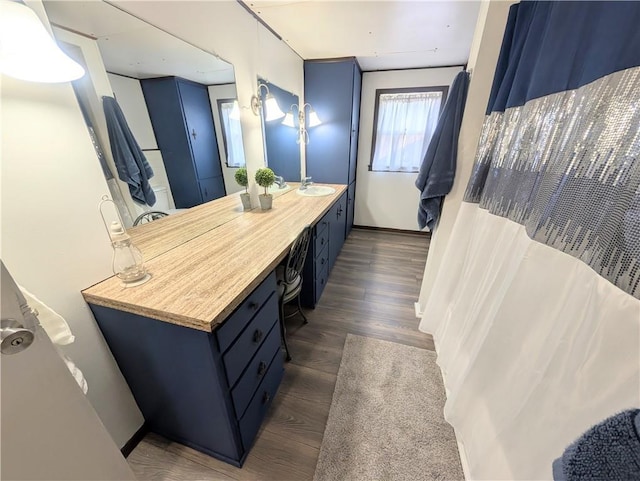 712 N Jefferson Ave, Iola, KS 66749 - full bath with wood finished floors and vanity