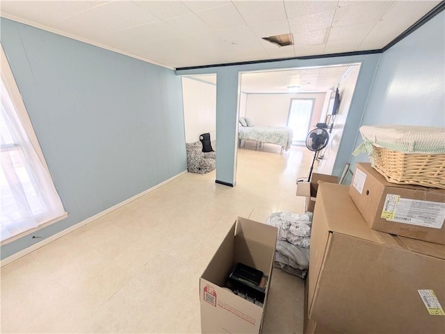 712 N Jefferson Ave, Iola, KS 66749 - corridor with ornamental molding and tile patterned floors