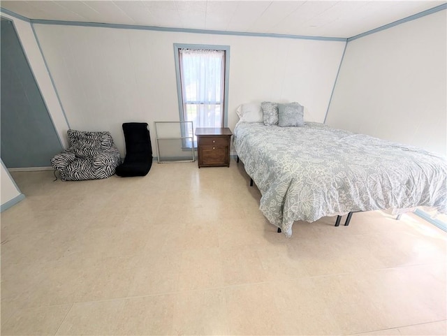 712 N Jefferson Ave, Iola, KS 66749 - bedroom featuring ornamental molding and light floors