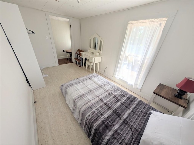 712 N Jefferson Ave, Iola, KS 66749 - bedroom with wood finished floors