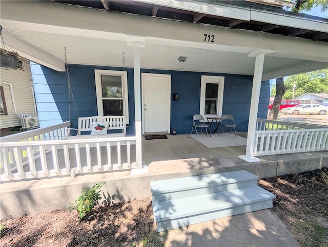 712 N Jefferson Ave, Iola, KS 66749 - property entrance featuring covered porch