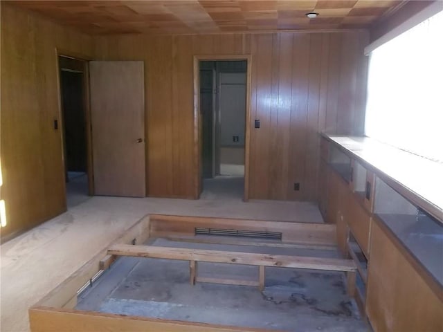 201 S Larson Ave, Chanute, KS 66720 - stairway featuring wood walls and wood ceiling