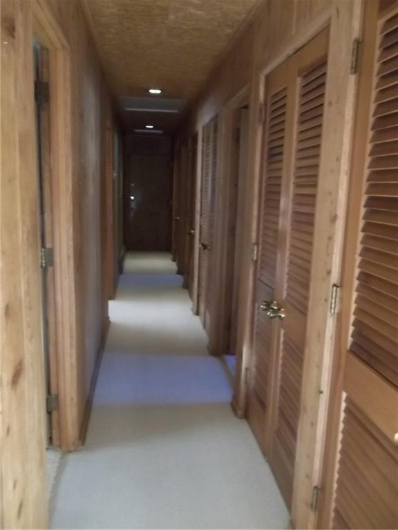201 S Larson Ave, Chanute, KS 66720 - hallway with light colored carpet