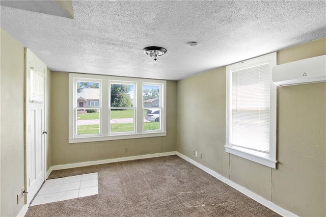 2514 Belmont Ave, Parsons, KS 67357 - carpeted spare room with an AC wall unit, a textured ceiling, and a smoke detector