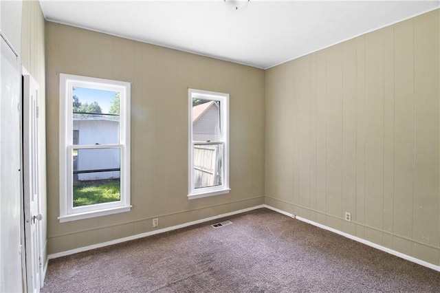 2514 Belmont Ave, Parsons, KS 67357 - carpeted empty room with healthy amount of natural light