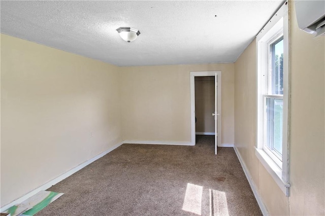 2514 Belmont Ave, Parsons, KS 67357 - spare room with carpet, plenty of natural light, and a textured ceiling