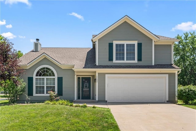 1103 N 2nd St E, Louisburg, KS 66053 - traditional-style home with driveway, a garage, a front lawn, and a shingled roof