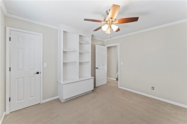 1103 N 2nd St E, Louisburg, KS 66053 - unfurnished bedroom with light colored carpet, crown molding, and ceiling fan