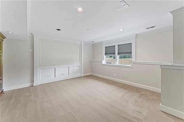 1103 N 2nd St E, Louisburg, KS 66053 - spare room featuring light carpet, crown molding, and recessed lighting
