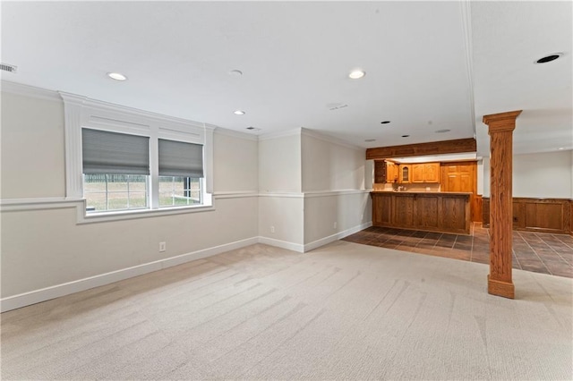 1103 N 2nd St E, Louisburg, KS 66053 - unfurnished living room with ornate columns, recessed lighting, light colored carpet, and ornamental molding