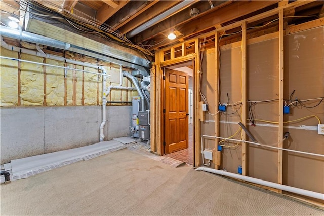1103 N 2nd St E, Louisburg, KS 66053 - unfinished below grade area with gas water heater and carpet floors
