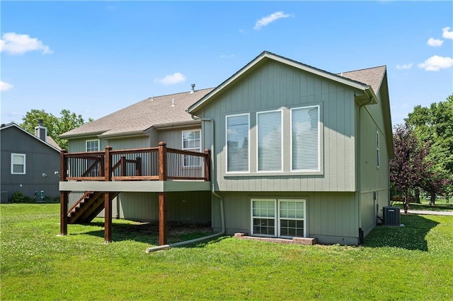 1103 N 2nd St E, Louisburg, KS 66053 - rear view of house with stairway, a wooden deck, and a yard