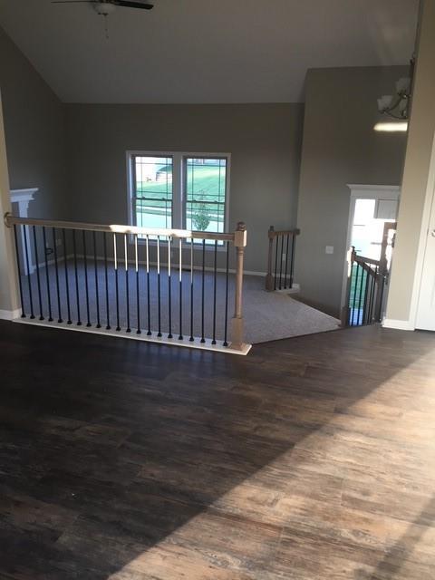 3812 SW Mcdanial Ave, Blue Springs, MO 64015 - empty room with dark wood finished floors and plenty of natural light