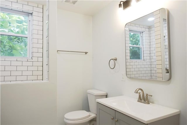 5032 E 8th St, Kansas City, MO 64124 - bathroom featuring vanity and healthy amount of natural light
