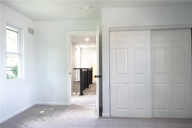 5032 E 8th St, Kansas City, MO 64124 - unfurnished bedroom with carpet flooring and a closet
