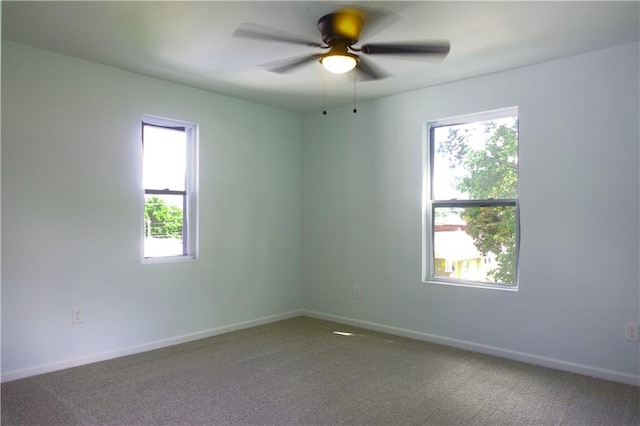 5032 E 8th St, Kansas City, MO 64124 - carpeted spare room featuring ceiling fan and baseboards